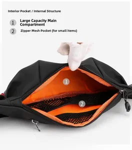 Detail view of the black waterproof bag showing orange lining and internal mesh zipper pocket