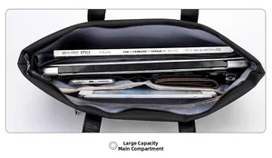 Detailed top view of a black laptop bag featuring a multi-layered interior storage system