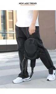 Detail of black waterproof Oxford cloth chest bag with adjustable padded strap and geometric pocket