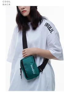 Close-up of a green nylon crossbody bag with BANQILU logo and adjustable shoulder strap