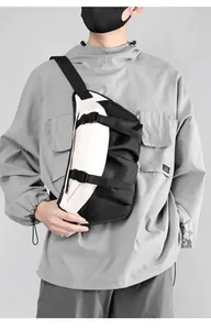 Detail of color-block chest bag featuring adjustable plastic buckles and durable nylon fabric