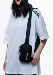 Street style black nylon crossbody phone bag with white BANQILU logo on a female model