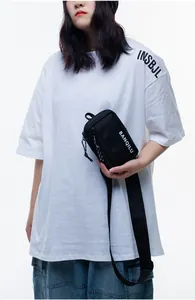 Close-up of the BANQILU logo and nylon fabric texture on a black crossbody bag