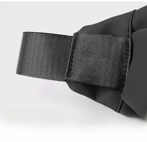 Detail of reinforced stitching on black nylon shoulder strap connector for durability