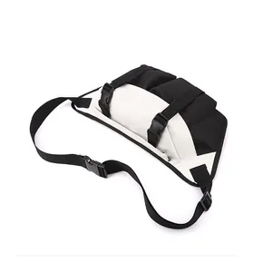 Detail view of the black and white cross body bag with buckle straps and Oxford fabric texture