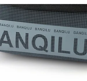 Close-up of durable tear-resistant tech fabric with premium branded logo print