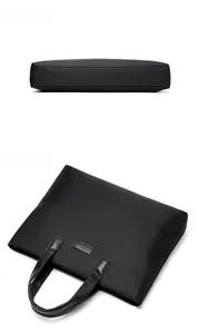 Detailed bottom and flat top views of a black nylon business laptop briefcase