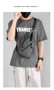 Detail of grey waterproof sling bag with USB port and adjustable shoulder strap