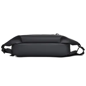 Detail view of the waterproof matte black tactical leg bag with adjustable nylon straps