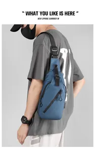 Close-up of a blue waterproof outdoor crossbody chest bag with multi-layer zipper pockets