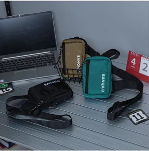 Three nylon crossbody bags in black, khaki, and green colors with adjustable straps