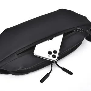 Detail view of the spacious inner compartment of the black tactical bag fitting a large phone