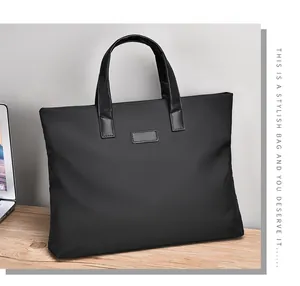 Business laptop briefcase with leather handles on a desk in an office setting
