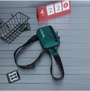 Close-up of the dark green crossbody bag featuring fine nylon texture and side logo