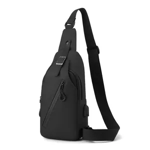 Waterproof black men's chest bag with USB charging port and multi-pocket storage
