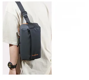 Detail of waterproof matte black sling bag showing adjustable strap and fashion logo