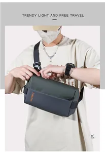 Detail of grey-green nylon crossbody bag with fashion text and adjustable buckle