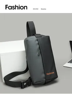Close-up of minimalist gray and black crossbody bag with orange fashion text logo