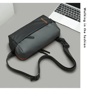 Close-up of waterproof nylon crossbody bag with fashion text and orange details