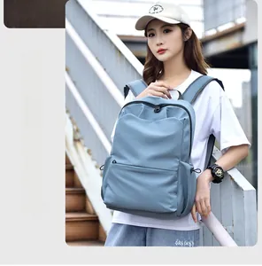 Detail view of the muted blue waterproof backpack with side adjustable buckle and large pocket