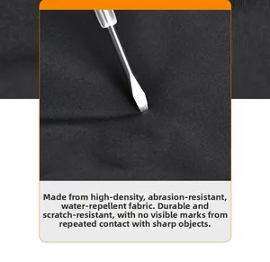 Detail of high-density waterproof black fabric showing scratch resistance and durability