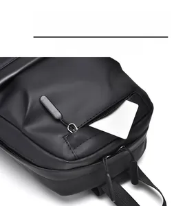 Detail of waterproof crossbody chest bag showing front hidden zipper pocket and compartments
