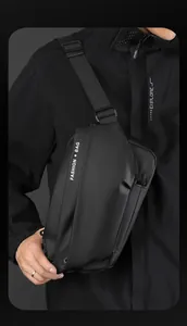 Detail of waterproof matte black crossbody bag with adjustable strap and fashion text logo