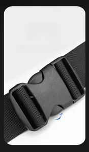 Detail shot of the quick-release magnetic buckle on a black tactical messenger bag