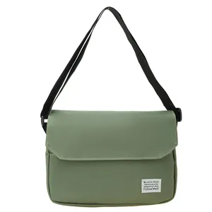 Army green minimalist canvas messenger bag with adjustable strap and flap cover