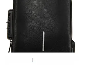 Close-up of black leather chest bag featuring a three-digit security combination lock
