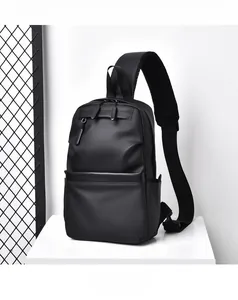 Detail of waterproof matte black sling bag showing multi-layer storage and wide strap