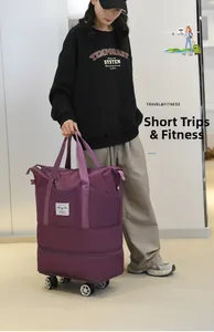 Purple travel bag with swivel wheels and separate shoe compartment for fitness