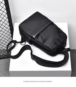 Detail view of black waterproof chest bag with adjustable shoulder strap and matte finish