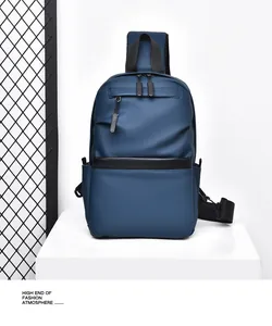 Detail view of navy blue water-resistant chest bag with black contrast strap and dual zippers