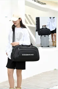 Travel bag attached to suitcase handle showing storage and versatile carrying options