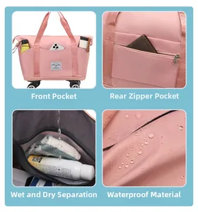 Detail view of pink travel bag showing front pocket, wet-dry section and back pocket