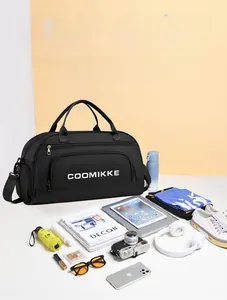 Flat lay of large travel duffel bag showing high capacity for clothes and camera gear