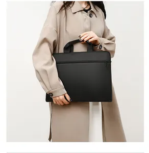 Slim 15.6 inch laptop bag in waterproof oxford cloth styled with a beige trench coat