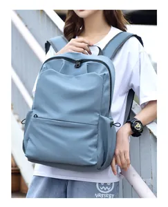 Detail view of the light blue waterproof nylon backpack with side drawstring pockets