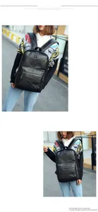 Fashionable black PU leather backpack for men showing diamond patch detail and front pocket