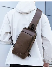 Men's retro leather chest bag featuring side USB charging port and anti-theft zipper detail