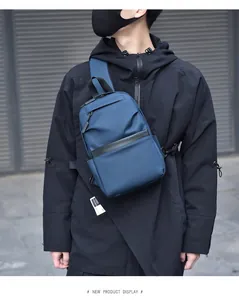 Detail view of water-resistant navy blue crossbody sling bag for men in urban casual style