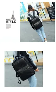 Close-up of black PU leather backpack showing premium texture and front zipper pocket detail