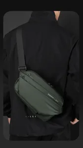 Close-up of waterproof dark green crossbody bag featuring magnetic buckle and strap