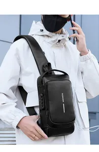 Detail of men's leather anti-theft sling bag with security combination lock and USB port