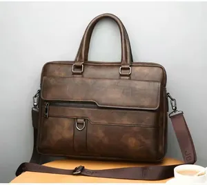 Close-up of a dark brown faux leather briefcase featuring woven Jeep shoulder strap detail