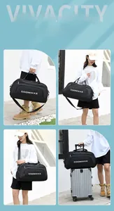 Detail of multi-functional black travel bag showing adjustable strap and luggage handle sleeve