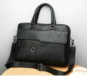 Close-up of black textured leather business briefcase with silver metal hardware and straps