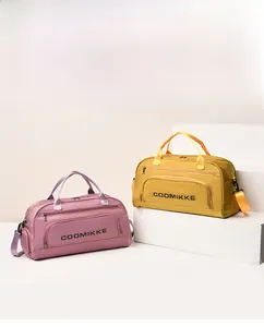 Detail of travel fitness bags in pink and yellow with waterproof nylon texture
