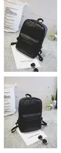 Detail view of stylish black PU leather backpack with minimalist square design and front pocket